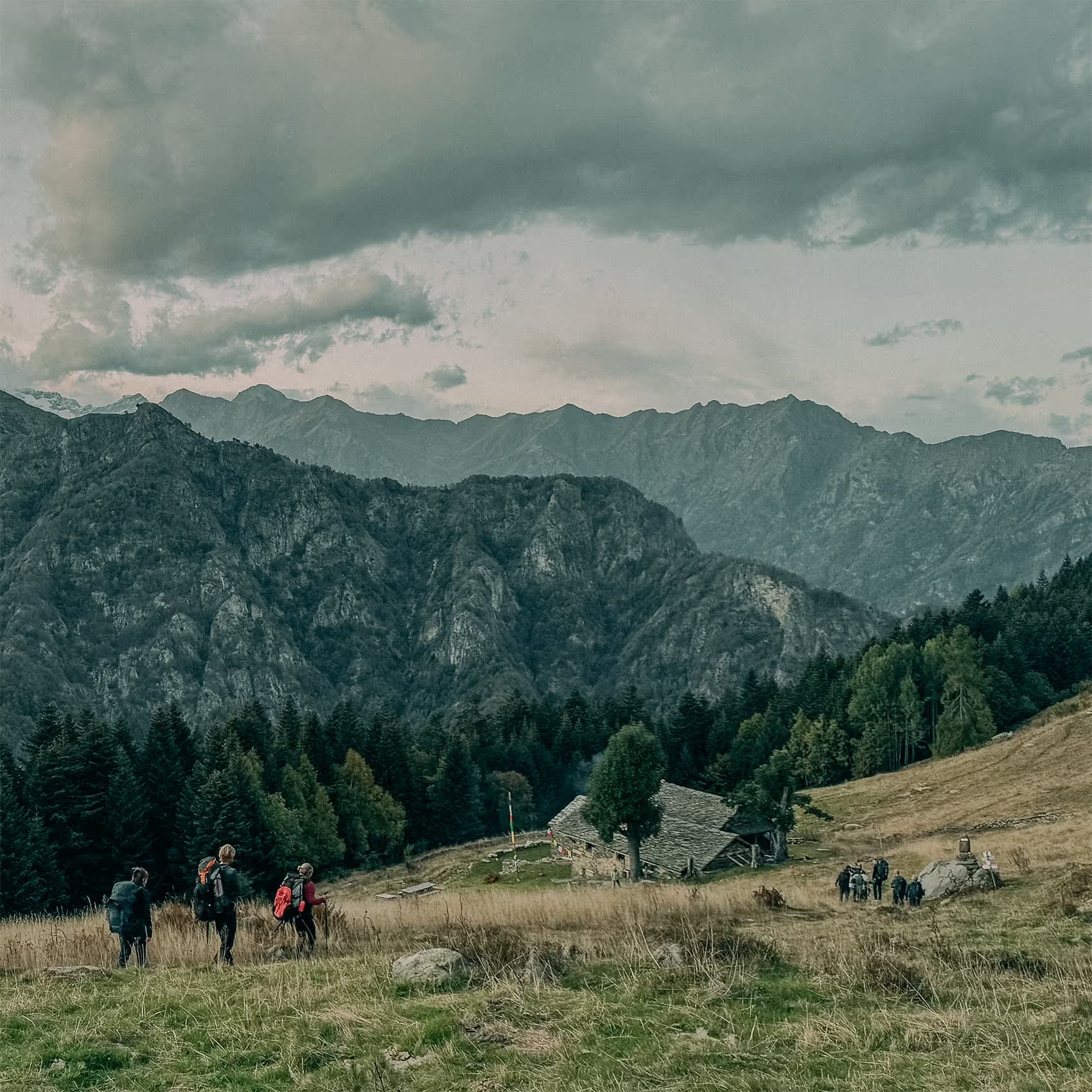 A participant sitting alone above the valley