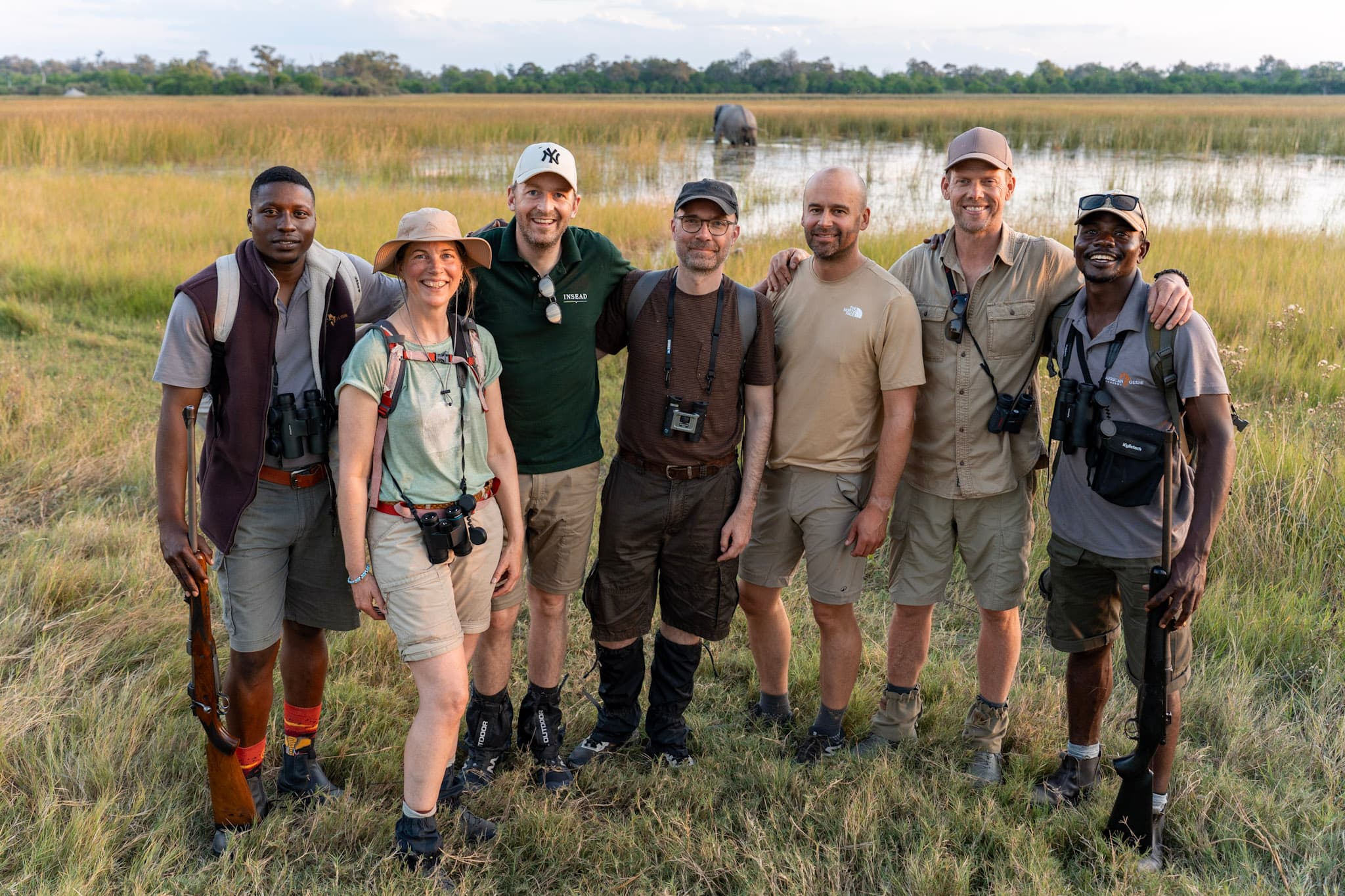 Walking single file through the Okavango bush at first light